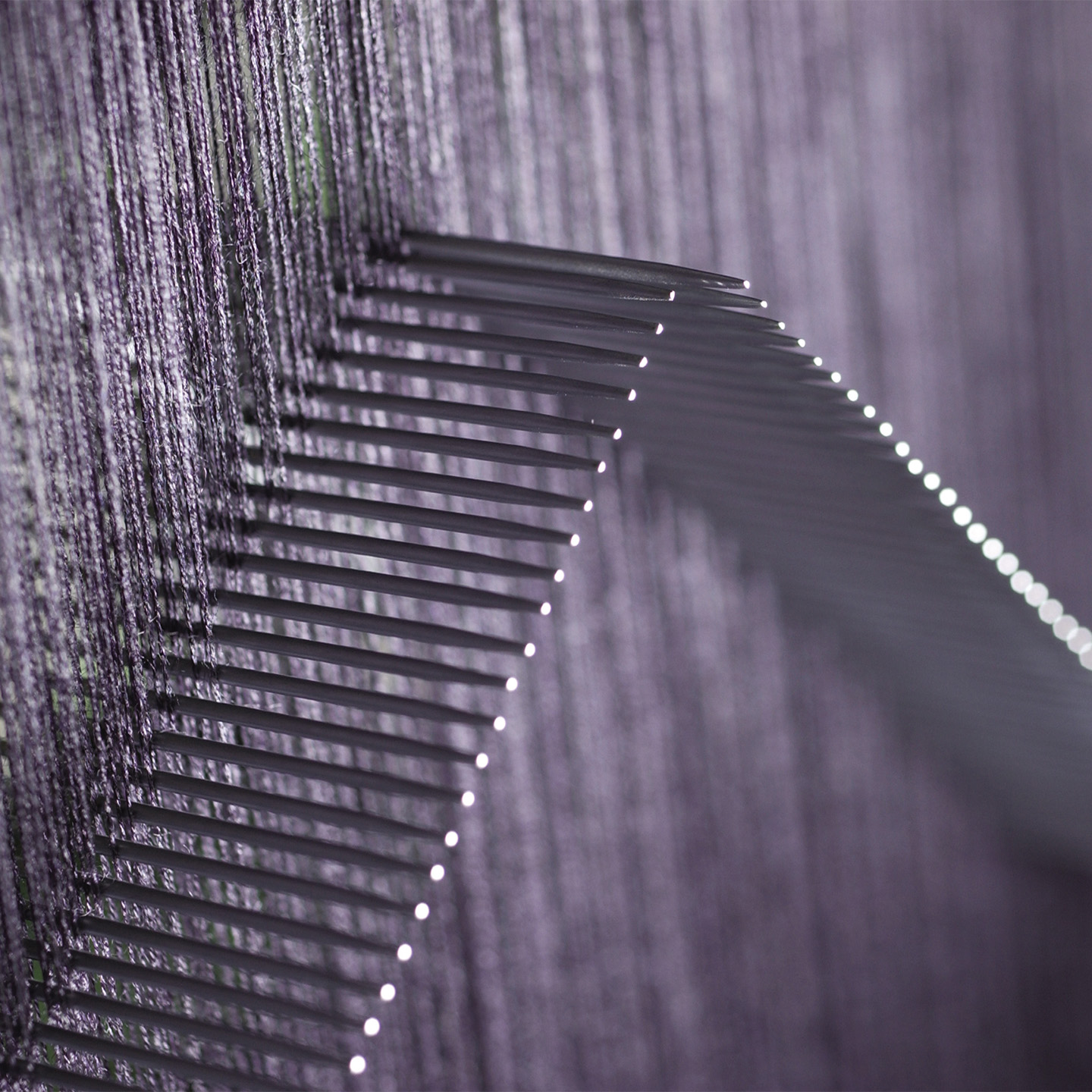 Wool weaving machinery at work